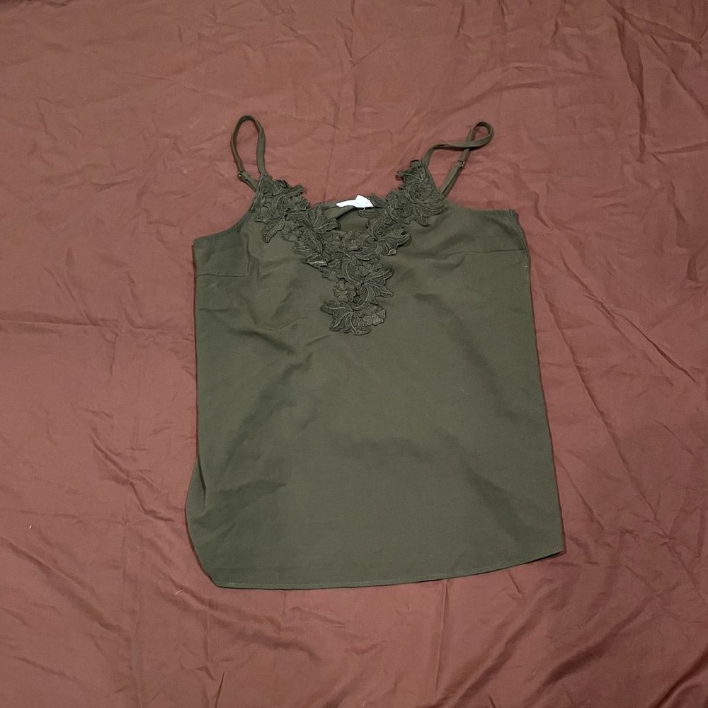 green tank-top with florals on it